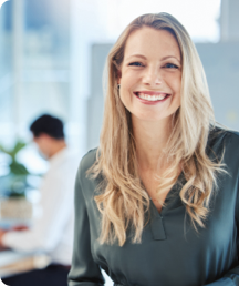 Blonde lady smiling at the camera